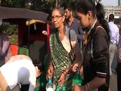 Delhi police officers' family members reach venue with water