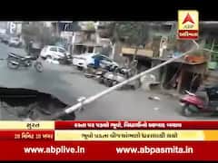 સુરતઃ ભૂવો પડતા વીજ પોલ થયો ધરાશાયી, જુઓ સીસીટીવી