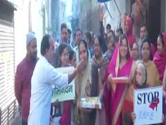 Varanasi women distribute sweets after Hyderabad encounter