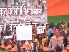 PM Modi's mega rally: People show placards supporting CAA, NRC