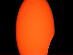 Sun looks like an orange ball in solar eclipse pictures from Hong Kong