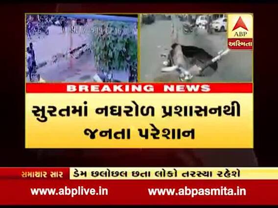 સુરતઃ માછીવાડ મેઇન રોડ પર વગર વરસાદે પડ્યો ભૂવો, વીજપોલ પણ થયો ધરાશાયી