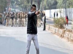 Jamia row: FULL video of man brandishing gun
