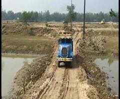 Reporter Stories: পরিবহন মন্ত্রীর নিষেধ, তবু পূর্ব মেদিনীপুরের হিজলি টাইটেল ক্যানেলে অবাধে চলছে মাটি পাচার