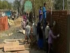 Wall being constructed near slum in Ahmedabad ahead of Trump's visit to India