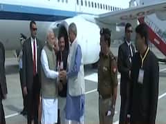 PM Modi arrives at Prayagraj airport, CM Yogi greets him