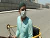 Differently-abled traveling home on tricycle