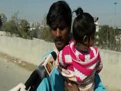 Man carrying 7-month-old on bicycle and heading Hardoi