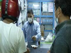 After a full day of curfew, people step out in evening to buy daily needs item