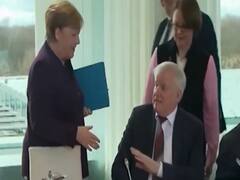 Coronavirus scare makes minister not shake hands with Angela Merkel
