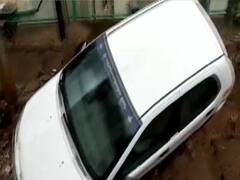 Car stuck as land caves in after heavy rainfall in Bengaluru