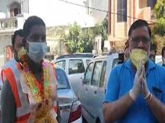 People at various places shower flowers on sanitation workers, police personnel