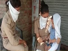 UP: Female Police officer performs duty with 1 year old child
