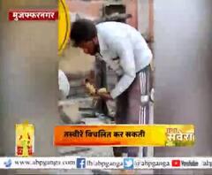 जमीन पर गिरा हुआ खाने को मजबूर शख्स