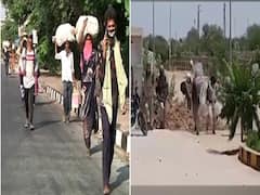 छोटे बच्चों के साथ Delhi से घर के लिए पैदल निकले लोग