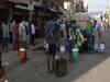 Two queues, two stories: People make beeline for water and alcohol in Delhi