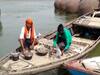 Migrants self-quarantine for 14 days on a boat in Varanasi