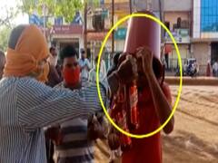 Man turns up to buy liquor with a bucket on his head