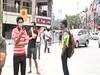 Noida: People fill bags with liquor bottles as shops reopen