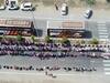 Surat: Aerial view of migrants standing in long queue for transport