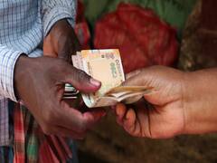 People gather to witness the Bihar ATM which dispensed double the cash