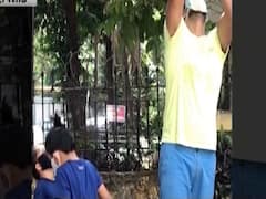 Shabir Ahluwalia picking mangoes with kids