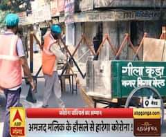 कोरोना वॉरियर्स को सलाम, लोगों के हाथ सेनिटाइज करते हैं अमजद। CoronaWarriors