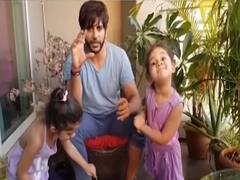 Karanvir Bohra teaching kids how to plant a sapling