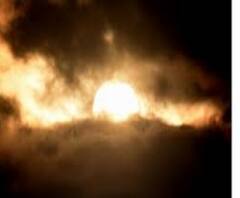 মেঘাচ্ছন্ন কলকাতার কিছু অংশ থেকে দেখা যাচ্ছে আংশিক সূর্যগ্রহণ