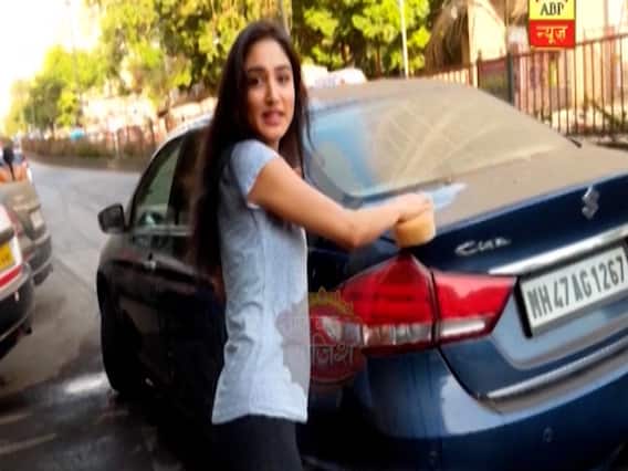 Donal Bisht cleans her car during lockdown