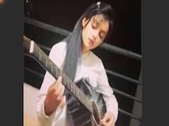 Mallika Singh plays 'Bella Ciao' on her guitar