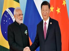 Irony: China does not retract forces and talks peace 