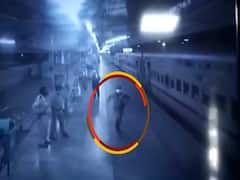 RPF jawan runs along a shramik train to provide milk to 4-month old
