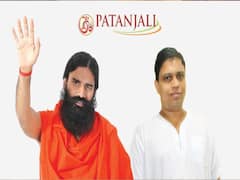 Patanjali ने किया Corona की दवाई बनाने का दावा, Acharya Balkrishna बोले- हजारों मरीज ठीक हुए