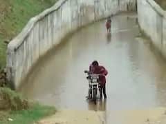 છોટાઉદેપુરની મેણ નદીમાં પાણીની થઇ આવક, જીવના જોખમે લોકો રસ્તા પરથી થઇ રહ્યા છે પસાર