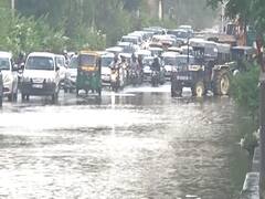 Delhi: Slow traffic due to water-logging created by rain