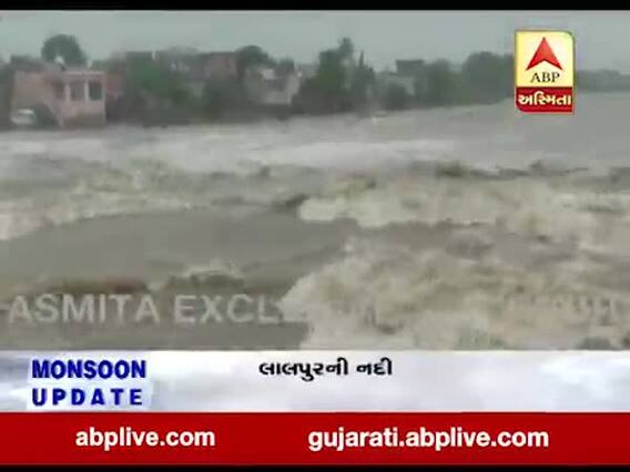 જામનગર: ધોધમાર વરસાદથી જામનગરના લાલપુરની નદી બની ગાંડીતુર, જુઓ વીડિયો