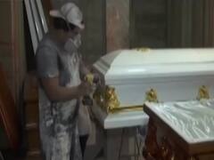 Peru: Covid-19 forces a 'joker' to work in coffin manufacturing industry