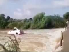 AP: Car washed away in flooded river in Anantapur