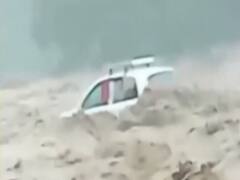 Uttarakhand: Car swept away in ravishing flood water, locals rescue family
