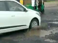 અમદાવાદના સરદાર પટેલ રિંગ રોડ પર પડ્યા ખાડા, કપચી ઉખડી જતા વાહન ચાલકો પરેશાન