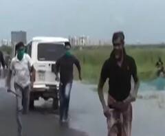 লকডাউন: ইকো পার্কের কাছে বৃষ্টির জলে মাছ ধরার প্রতিযোগিতা, বাজেয়াপ্ত মাছ ও জাল 