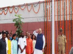 74th I-Day: Amit Shah hoists the National Flag at his residence