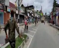 ধূপগুড়িতে লকডাউন না মেনে সাইকেল নিয়ে রাস্তায় মানুষ, লাঠি উঁচিয়ে তাড়া পুলিশের 
