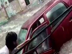 Mathura: Car swept away in rain water, locals save inspector