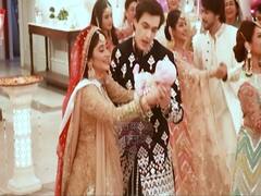 Naira celebrates baby shower in front of father-in-law's poster 