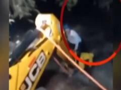 Pune: Man stuck in flowing water rescued using JCB