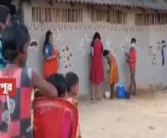 করোনা আবহেই বাঁদনা পরবে সেজে উঠছে গ্রামবাংলা, বাড়ির দেওয়ালজুড়ে নানা নকশা, উঠোনে আলপনা 