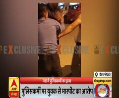 ग्रेटर नोएडाः नशे में पुलिसकर्मी का ड्रामा, पिस्टल लहराते हुए किया बवाल | ABP Ganga 