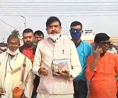 Gangasagar 2021: সমুদ্রতটে দাঁড়িয়ে ই-স্নান সারলেন খোদ দমকলমন্ত্রী Sujit Bose